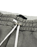 DRIPNORD AMIRI aged grey cotton sweatpants with white drawstring and silver hardware.