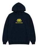 DRIPNORD navy blue cotton hoodie with yellow Balenciaga logo graphic on chest and front pocket.