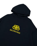 DRIPNORD navy blue cotton hoodie with yellow Balenciaga logo graphic on chest. Size S fits XL.