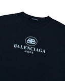 DRIPNORD black cotton t-shirt with white Balenciaga Mode logo and BB emblem on chest. Crew neck, short sleeves.