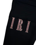 DRIPNORD black denim jeans with rose gold Amiri logo embroidery.