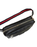 DRIPNORD black GG monogram belt bag with red and blue striped strap and silver zippers.