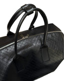 DRIPNORD black intrecciato-woven calfskin duffel bag with twin rolled handles and a two-way zip closure.