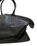 DRIPNORD black intrecciato-woven calfskin holdall duffel bag with twin carry handles and zip closure.