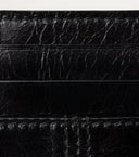DRIPNORD black textured leather card holder with multiple card slots and visible stitching.
