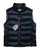 DRIPNORD black puffer vest with a high collar and yellow snap closure. Features a full zip front and zippered pockets.