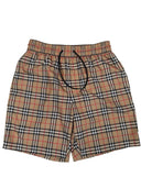 DRIPNORD Burberry Monogram swim shorts in beige, black, red, and white plaid pattern with drawstring waist.