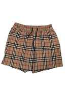 DRIPNORD Burberry monogram swim shorts in beige, black, red, and white plaid pattern. Elastic waistband with drawstring.