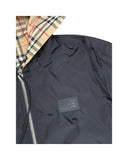 DRIPNORD Burberry Monogram Reversible Jacket in black with iconic check lining. Features a zip closure and leather logo patch.