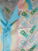 DRIPNORD Casablanca Ping Pong silk shirt with a pastel wavy stripe pattern and a graphic print. Features a chest pocket and light blue collar.