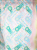 DRIPNORD Casablanca Ping Pong silk shorts with a white base and pastel geometric pattern. Features a pocket and wavy side panel.