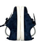 DRIPNORD Christian Louboutin Junior Spikes navy blue suede low-top sneakers with black spikes and white soles.