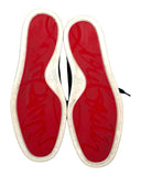 DRIPNORD Christian Louboutin Junior Spikes sneakers with iconic red soles and white rubber trim.