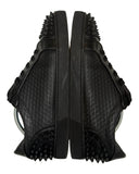 DRIPNORD black leather Christian Louboutin Seavaste 2 Orlato Flat sneakers with signature spikes and diamond-patterned texture.