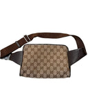 DRIPNORD Gucci GG canvas belt bag in brown with adjustable strap and leather trim. Classic monogram pattern.