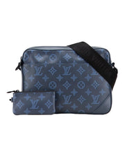 DRIPNORD Louis Vuitton Shadow Duo Messenger bag in navy blue with tonal monogram pattern and black strap, includes matching pouch.