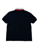DRIPNORD navy blue short-sleeve polo shirt with red and white collar detail and white stripe on shoulder.