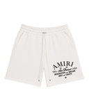 DRIPNORD white cotton Amiri Arts District shorts with drawstring waist and black graphic print.